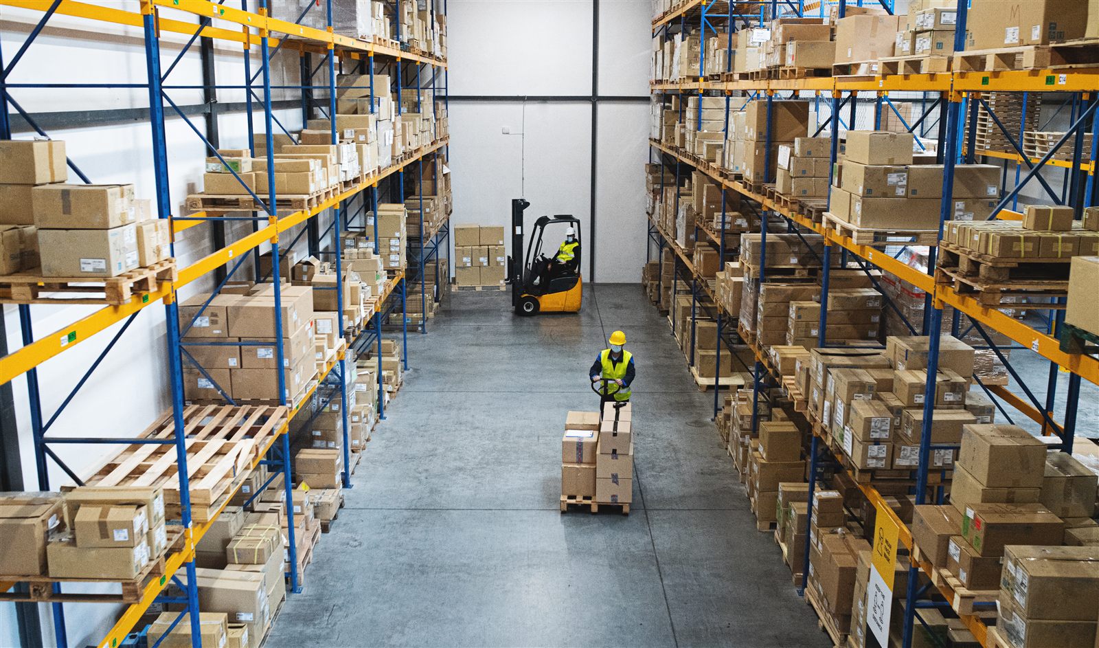 Warehouse team moving industrial inventory